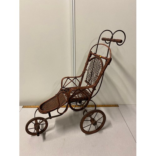 63 - Vintage ornate wicker 3 wheel dolls pram.
69cm h