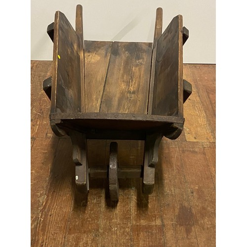 64 - Wooden wheelbarrow garden planter.