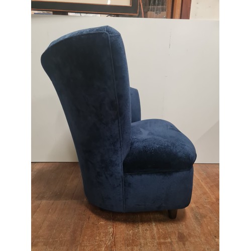 219 - Modern Scallop back lounge chair in blue velvet upholstery.