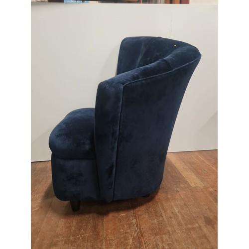 219 - Modern Scallop back lounge chair in blue velvet upholstery.