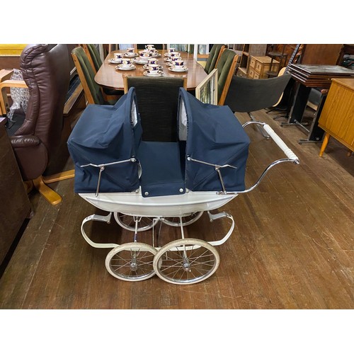 23 - Silver Cross coach built double dolls pram with original pram set. brake needs attention