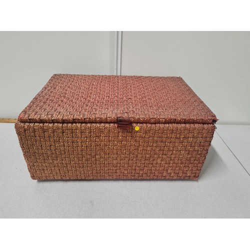 187 - Large rattan box with silk lining.