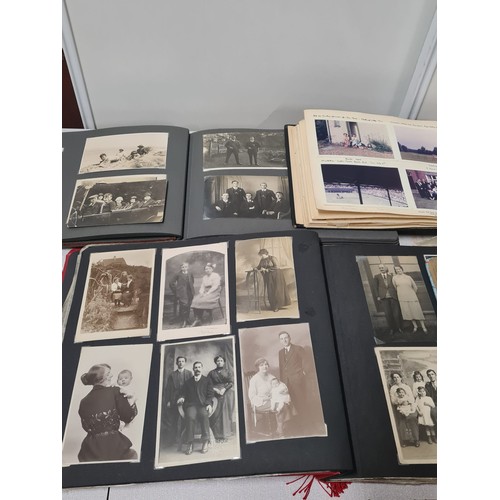 235 - 5 photo albums filled with antique photographs.