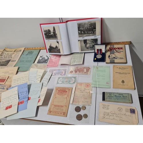 236 - Selection of war items to include WW2 air force photographs, armed forces money, coupons and letters... 