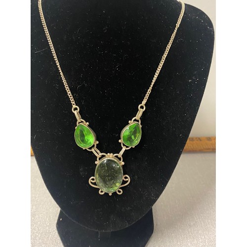 497 - silver necklace with peridot gem set stones