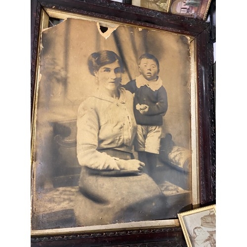 505 - Collection of antique photographs, mirror and large Victorian photo frame.