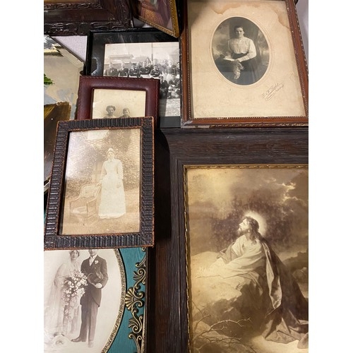 505 - Collection of antique photographs, mirror and large Victorian photo frame.