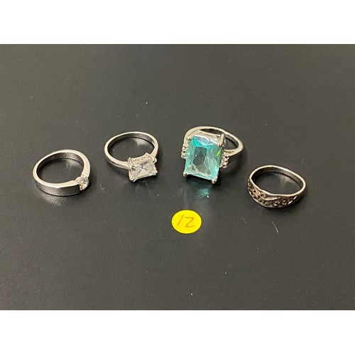 94 - 4 x silver rings- 3 gem set.