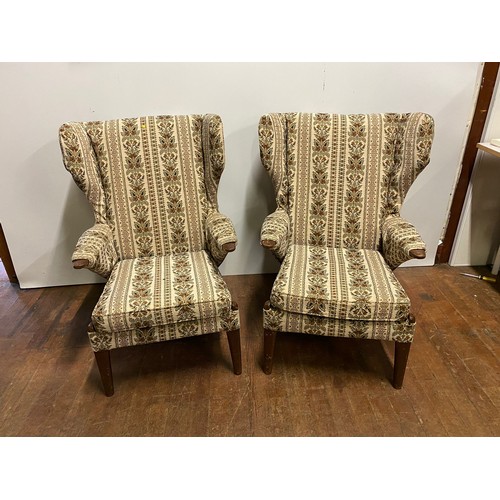 136 - Pair of vintage Parker Knoll upholstered wing back armchairs.