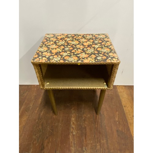 162 - Lloyd Loom bedside cabinet with floral top.