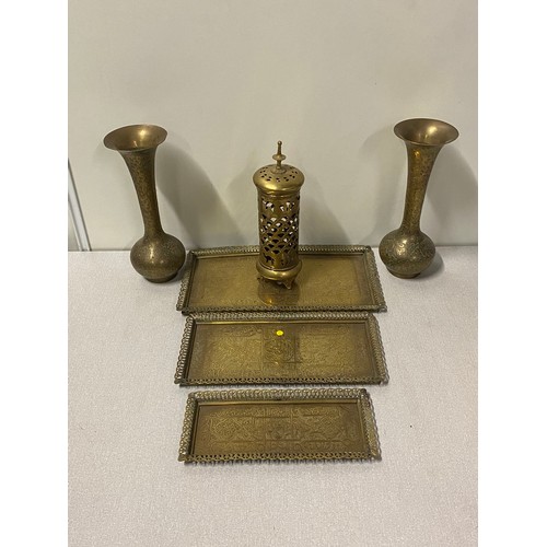 88 - Selection of Indian brass items to include 3 trays, pair of vases and candle holder.