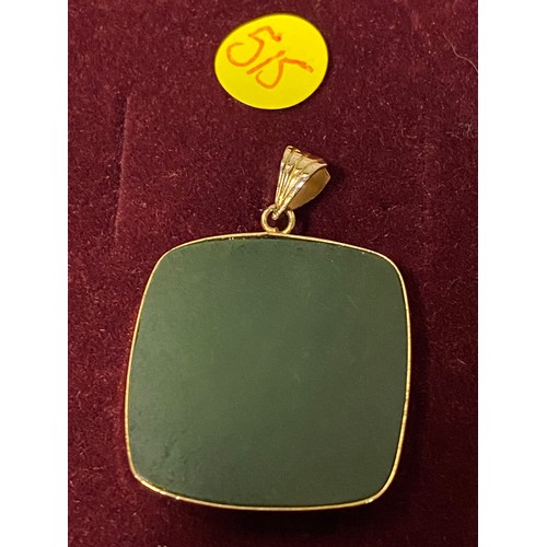 165 - 9ct gold and jade pendant.