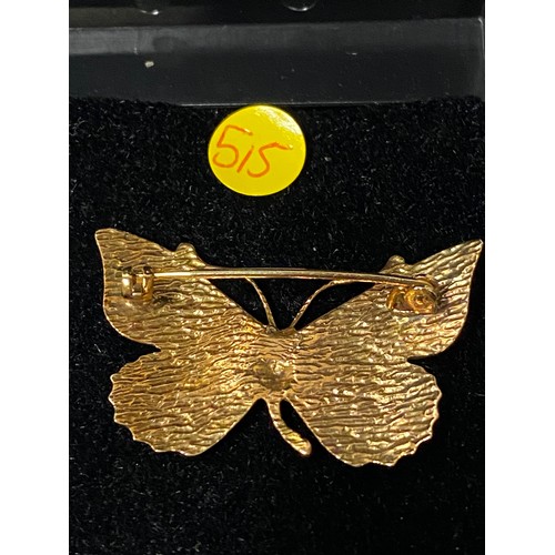 166 - Unmarked gold and enamel butterfly brooch.