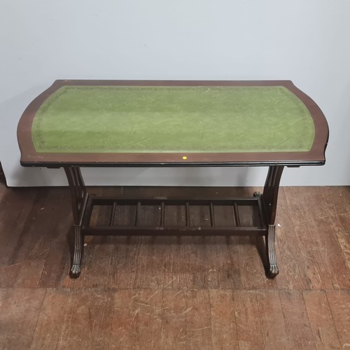 601 - Green leather topped coffee table.
90cm