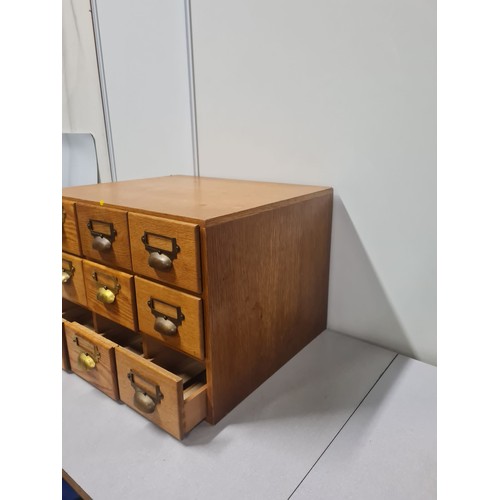 23 - Solid wood 9 drawer index card cabinet.
50cm l x 42cm d x 35cm h