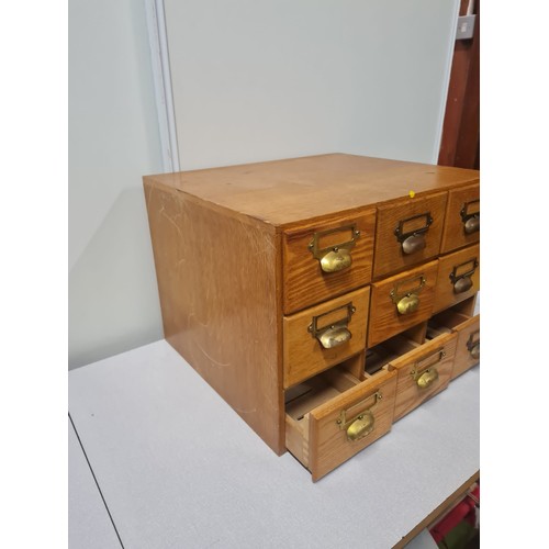 23 - Solid wood 9 drawer index card cabinet.
50cm l x 42cm d x 35cm h