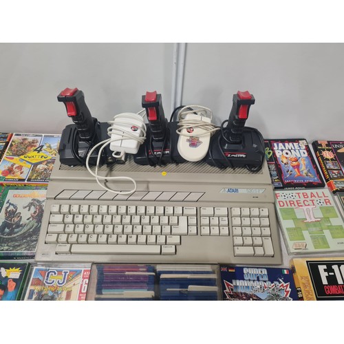 37 - Atari ST Compute, 3 joy sticks and 2 computer mice and large collection of games to include Batman a... 