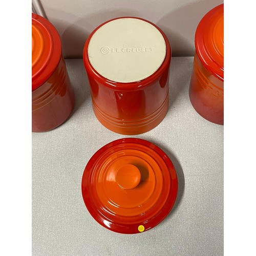 35 - 3 x Le Creuset storage jars in volcanic orange/red.