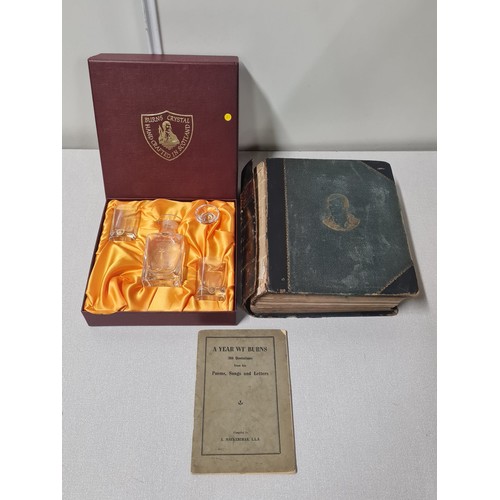 49 - Burns Scottish crystal decanter and glass set in fitted box along with 2 Burns poetry books.