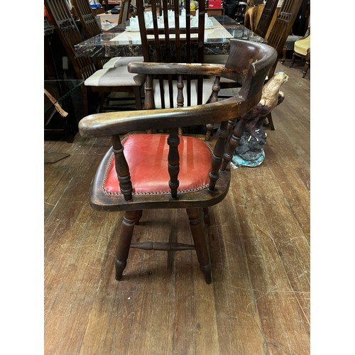 54 - Antique smokers bow/captain's chair with red leather studded seat.