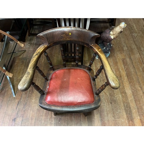 54 - Antique smokers bow/captain's chair with red leather studded seat.