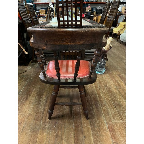 54 - Antique smokers bow/captain's chair with red leather studded seat.