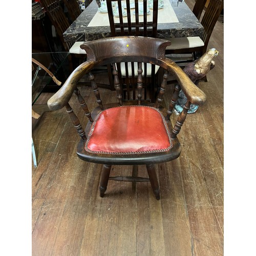 54 - Antique smokers bow/captain's chair with red leather studded seat.