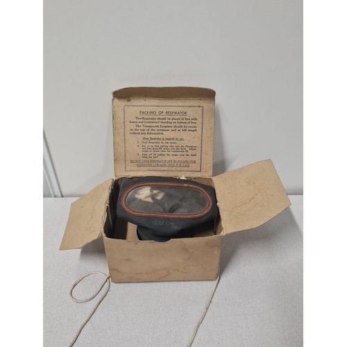 66 - WWII gas mask with original carboard box.