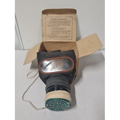 66 - WWII gas mask with original carboard box.