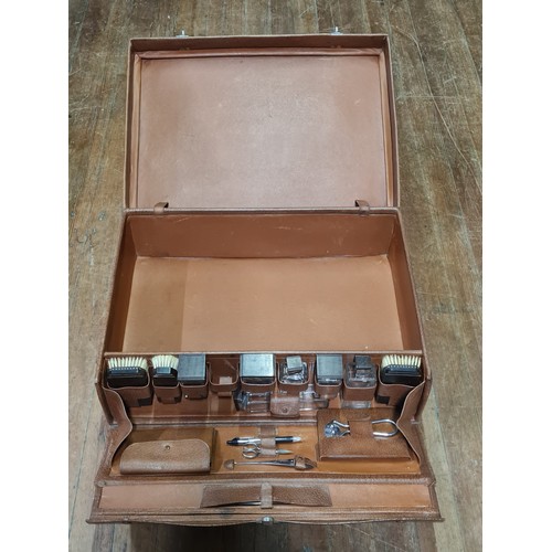 72 - Vintage gentleman's travel vanity suitcase with accessories to include brushes and aftershave bottle... 