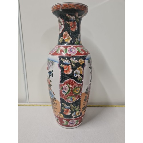 174 - Large Oriental vase depicting birds and cherry blossom trees.
60cm h