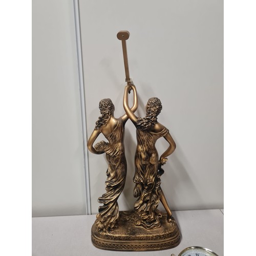 243 - Reproduction figurine table clock- needs attention.
75cm h