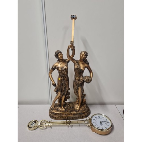 243 - Reproduction figurine table clock- needs attention.
75cm h