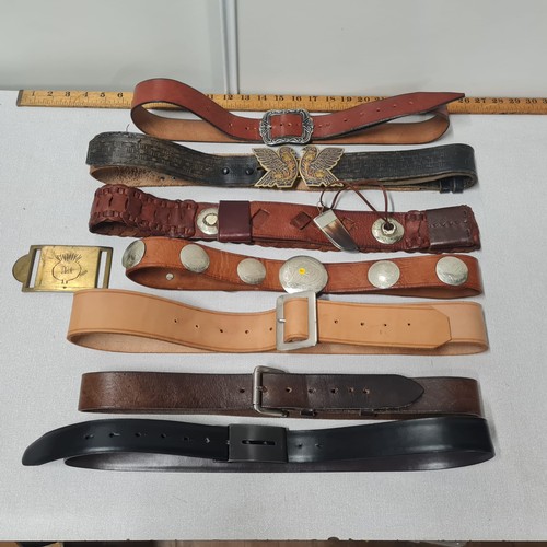 602 - 7 leather belts and brass buckle.