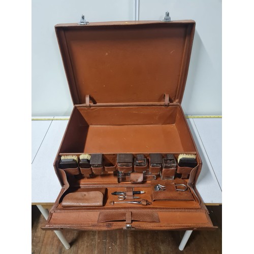 72 - Vintage gentleman's travel vanity suitcase with accessories to include brushes and aftershave bottle... 