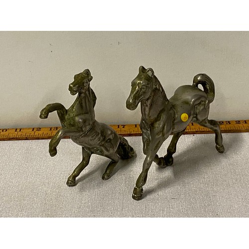 320 - pair of heavy metal horses