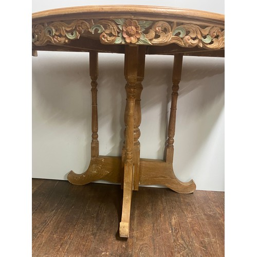 495 - Vintage oak half moon  table with carved floral design. Slight damage to the carving.
100cm x 76cm h... 