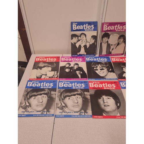 57 - Collection of 21 The Beatles Monthly Bok magazines.