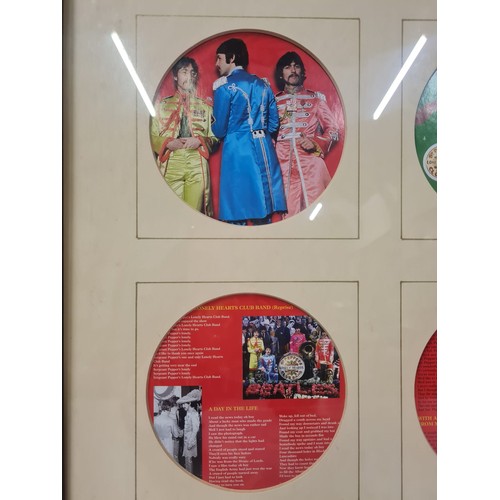 58 - 2 x The Beatles Sgt Peppers framed wall hangings.
40cm x 50cm