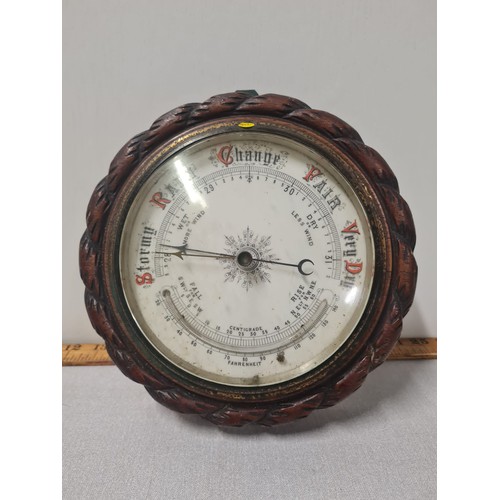 74 - Antique oak framed ships barometer.
23cm diameter.