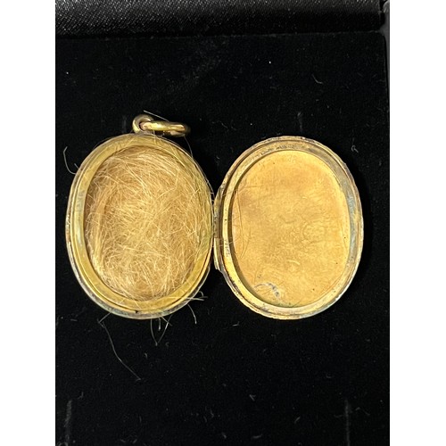 276 - unmarked victorian gold & pearl mouring locket with hair
testing over 9ct 
8.8 grams