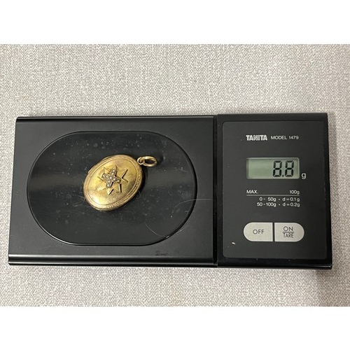 276 - unmarked victorian gold & pearl mouring locket with hair
testing over 9ct 
8.8 grams