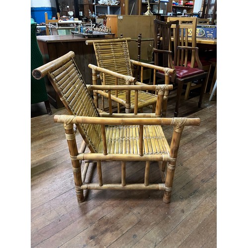 99 - Pair of mid - century bamboo lounge chairs.