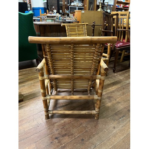 99 - Pair of mid - century bamboo lounge chairs.