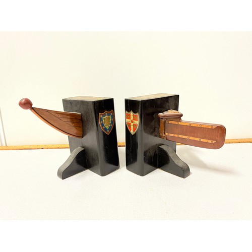 130 - Pair of vintage rowboat book ends showing the crests of Cambridge University and Downing college.