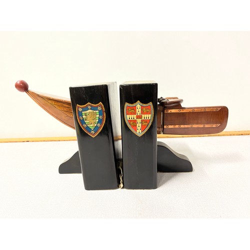 130 - Pair of vintage rowboat book ends showing the crests of Cambridge University and Downing college.