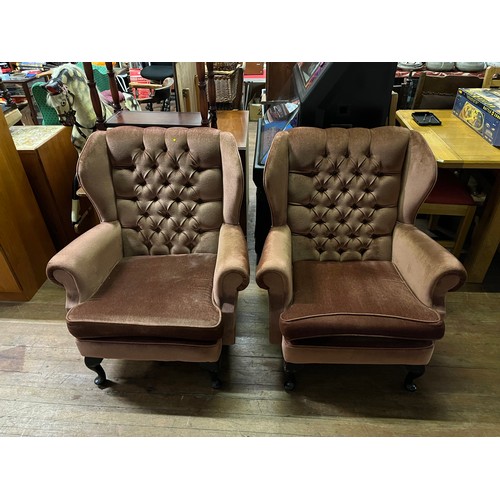 141 - Pair of vintage gull wing armed chairs.