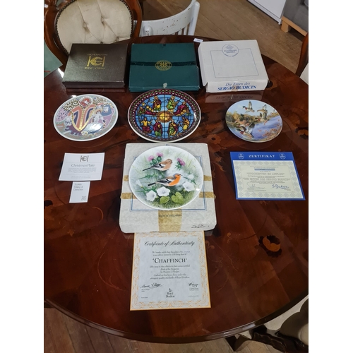 458 - 4 Boxed decorative plates, to include Royal Doulton & Highland Fine Bone China etc.