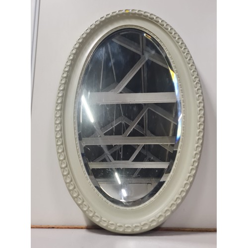 435 - Oval wall mirror.
82cm l