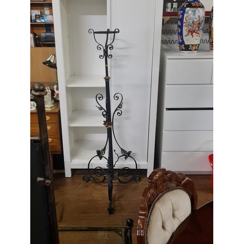 13 - Wrought iron rise and fall decorative plant stand.